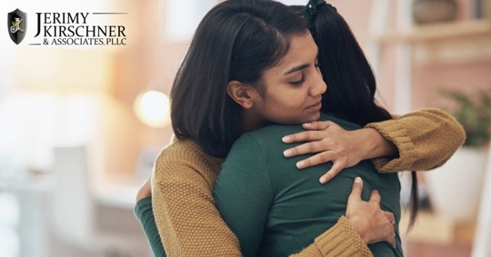 Indian adult daughter hugging her mother